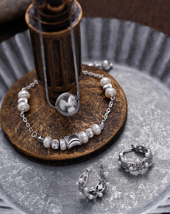 Pearl-like beads and silver-colored accents in the November reference photograph